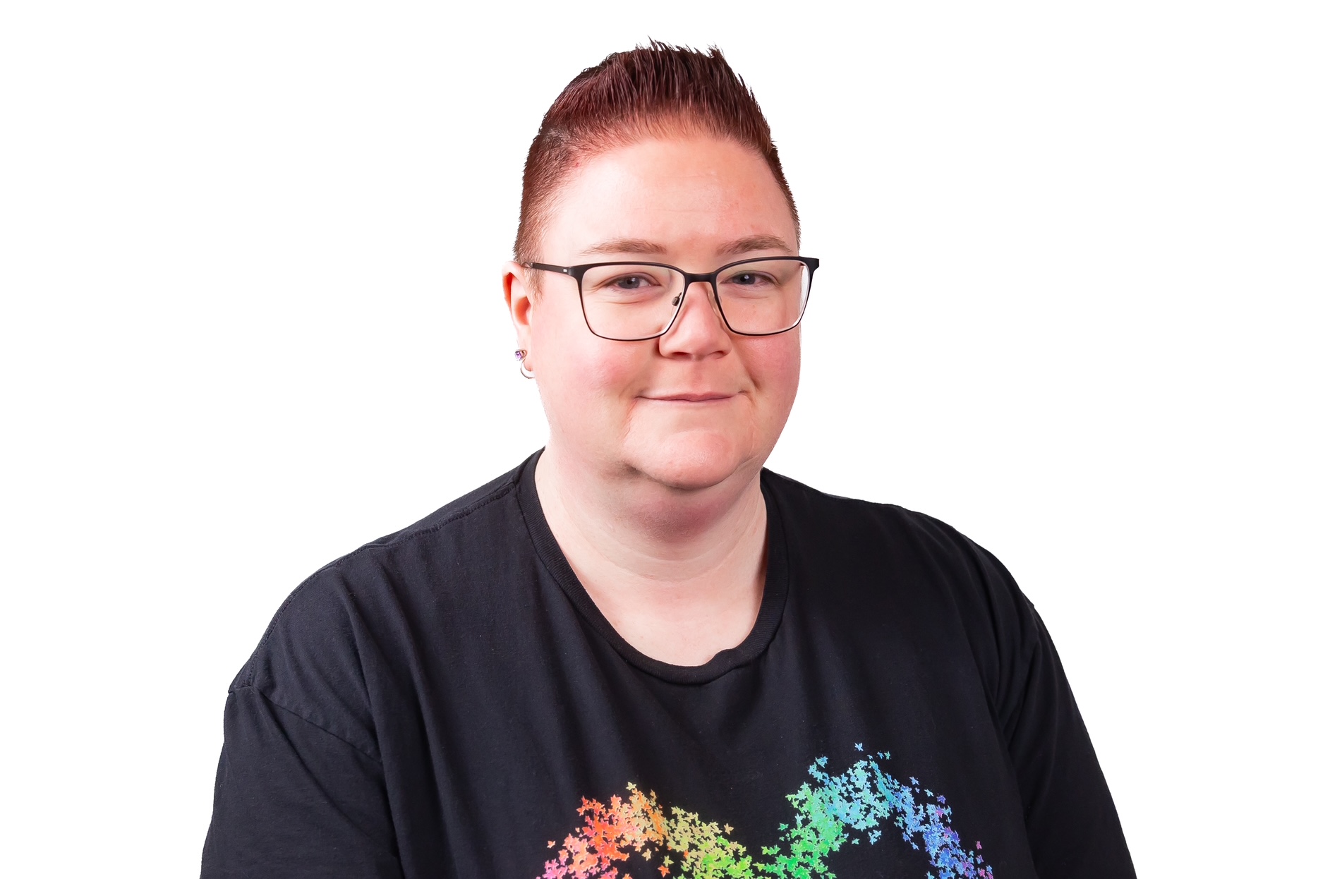 Woman with short red hair and glasses wearing a black t-shirt.
